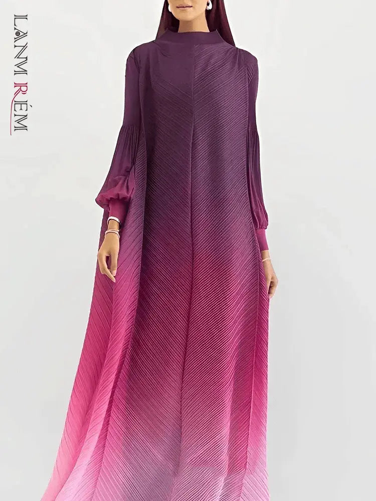 Close-up of the gradient color transition on a women's pleated long dress, showcasing the vibrant and elegant hues.