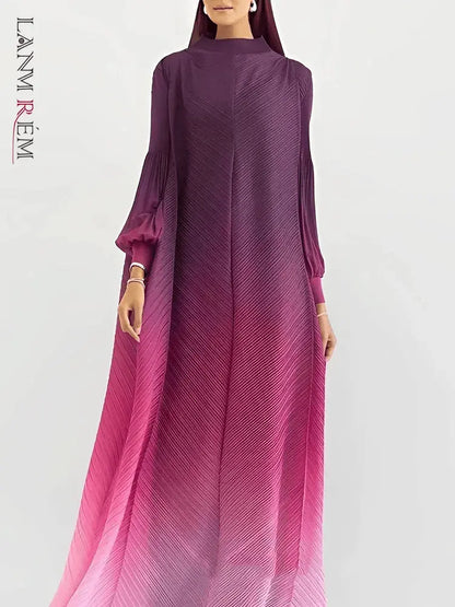 Close-up of the gradient color transition on a women's pleated long dress, showcasing the vibrant and elegant hues.