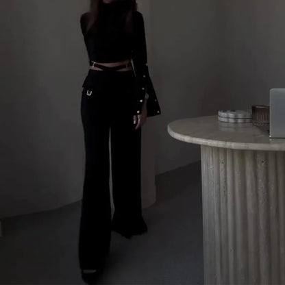 Black two-piece set with turtleneck top and wide-leg pants