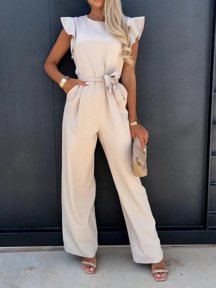 Women's vintage loose-fit white jumpsuit with sashes decoration, full-length pants, polyester material.
